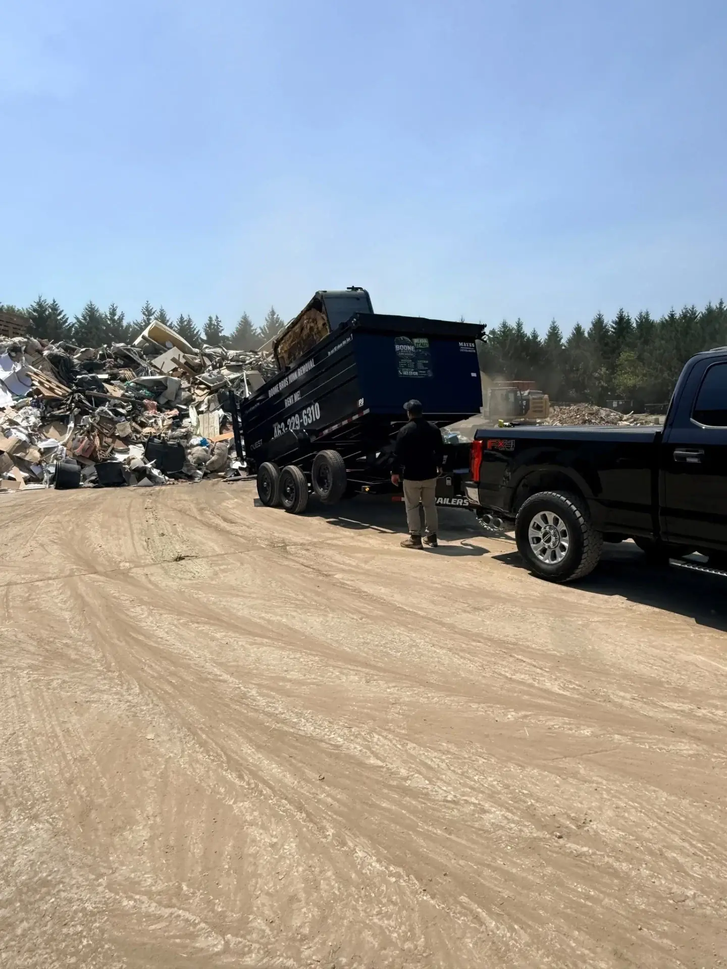 Boone Bros rig unloading at the dump site